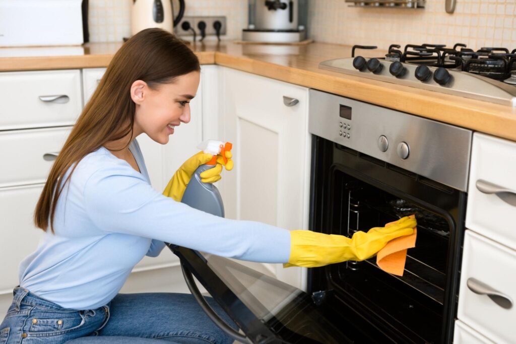 Worker Clean the Kitchen Oven in Holden