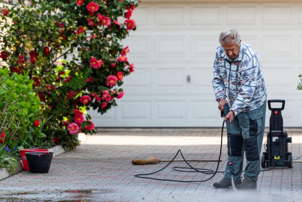 Worker Cleaning Home-Exterior in Northbridge